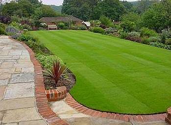 Landscaped garden with brick and paved border